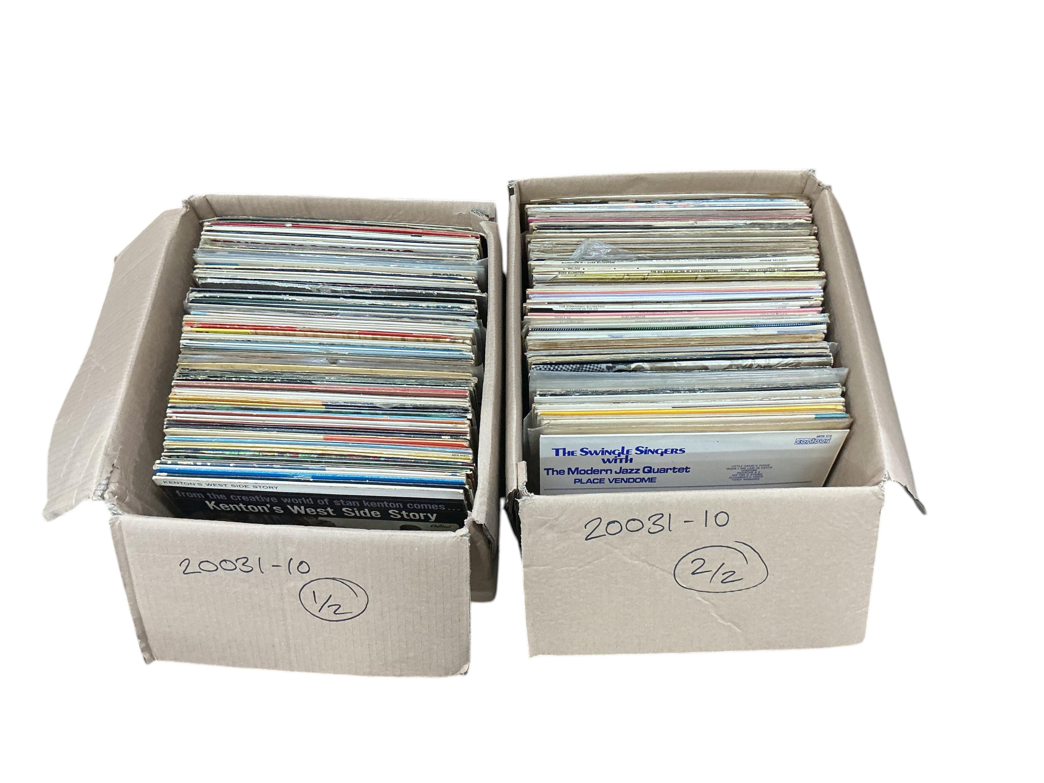 Two boxes of jazz LP record albums, artists including; Duke Ellington, Louis Armstrong, Dave Brubeck, The Modern Jazz Quartet, Stan Kenton, Ella Fitzgerald, Frank Sinatra, Benny Goodman, Ray Charles, Sarah Vaughan, etc.